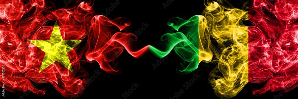 Vietnam, Vietnamese vs Mali smoke flags side by side. Vietnam, Vietnamese vs Mali smoke flags side by side.