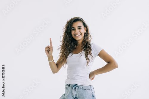 Young pretty woman pointed up isolated on white background