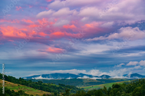 Pink sunset sky in the mountains.