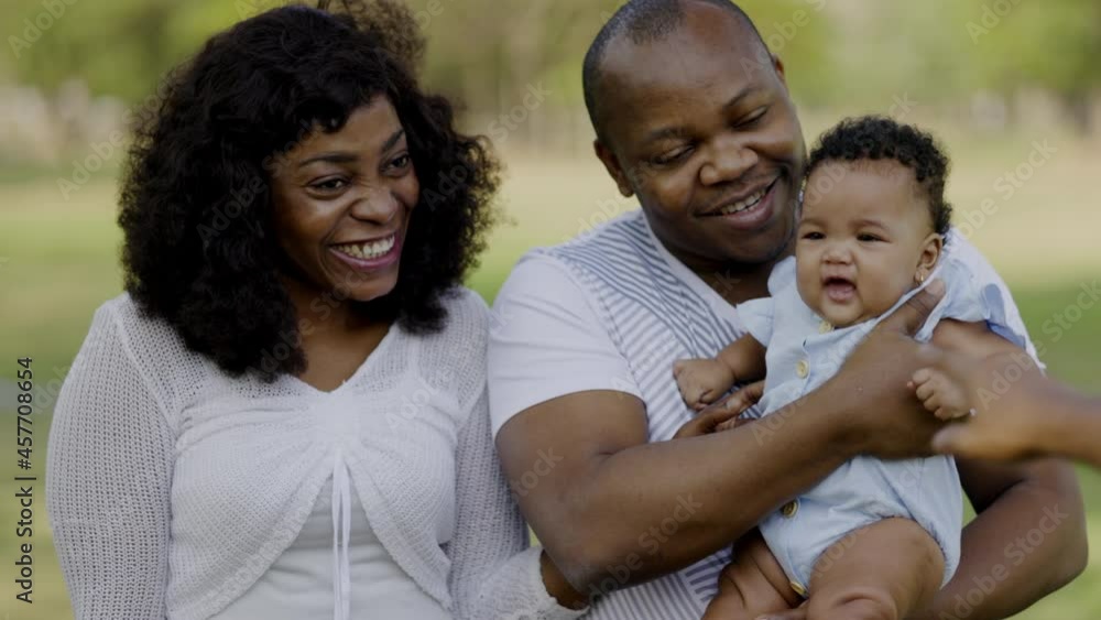 African American family Parent of newborn children take happy picnic hold or hug lovely in summer garden with trees. Weekend activity happy family lifestyle concept. take care with love stay together
African American family Parent of newborn children take happy picnic hold or hug lovely in summer garden with trees. Weekend activity happy family lifestyle concept. take care with love stay together