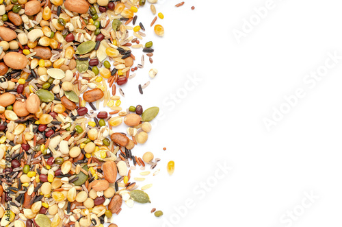 Mixed dry organic cereal and grain seed pile on white background with copy space for adding text