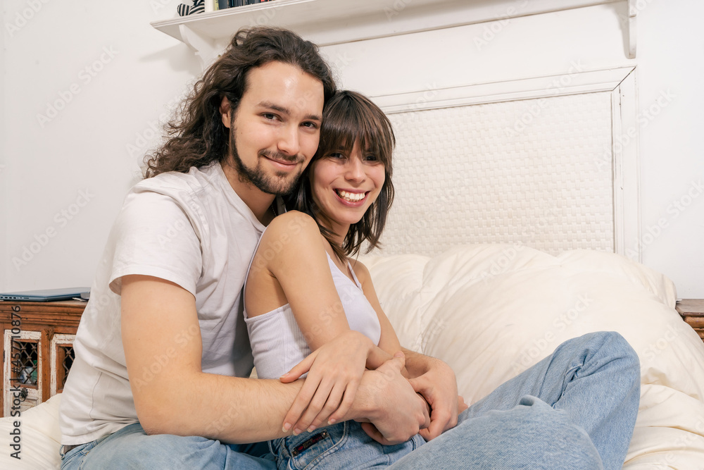 Portrait of a happy couple laughing at camera Portrait of a happy couple laughing at camera