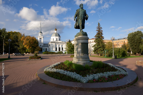 Beautiful city Tver landscape view of monument to Afanasy Nikitin on river Volga embankment with Resurrection church and sky, trees and russian buildings. Small city architecture concept. Tver, Russia