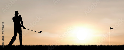 Man playing golf. Man, golfer against the background of the sky and the sun. A man plays golf at sunset 
