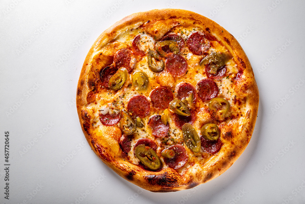 Hot Pepperoni Pizza with Mozzarella cheese, salami, Tomato sauce, pepper, Spices. Hot Pepperoni Pizza with Mozzarella cheese, salami, Tomato sauce, pepper, Spices.