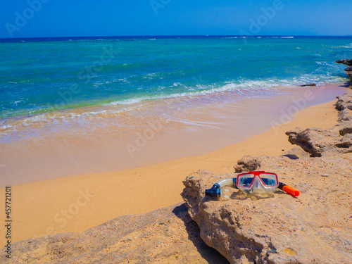 Beautiful wild beach with turquoise water, orange sand and coral reef. Egypt, Marsa alam. Red sea