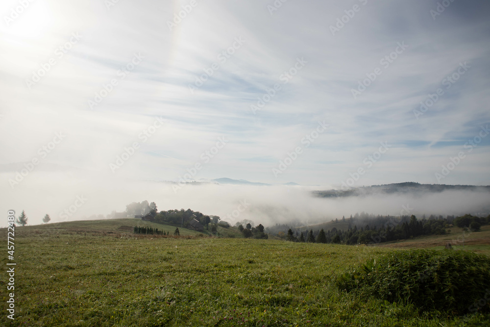 view of the mountains in the fog