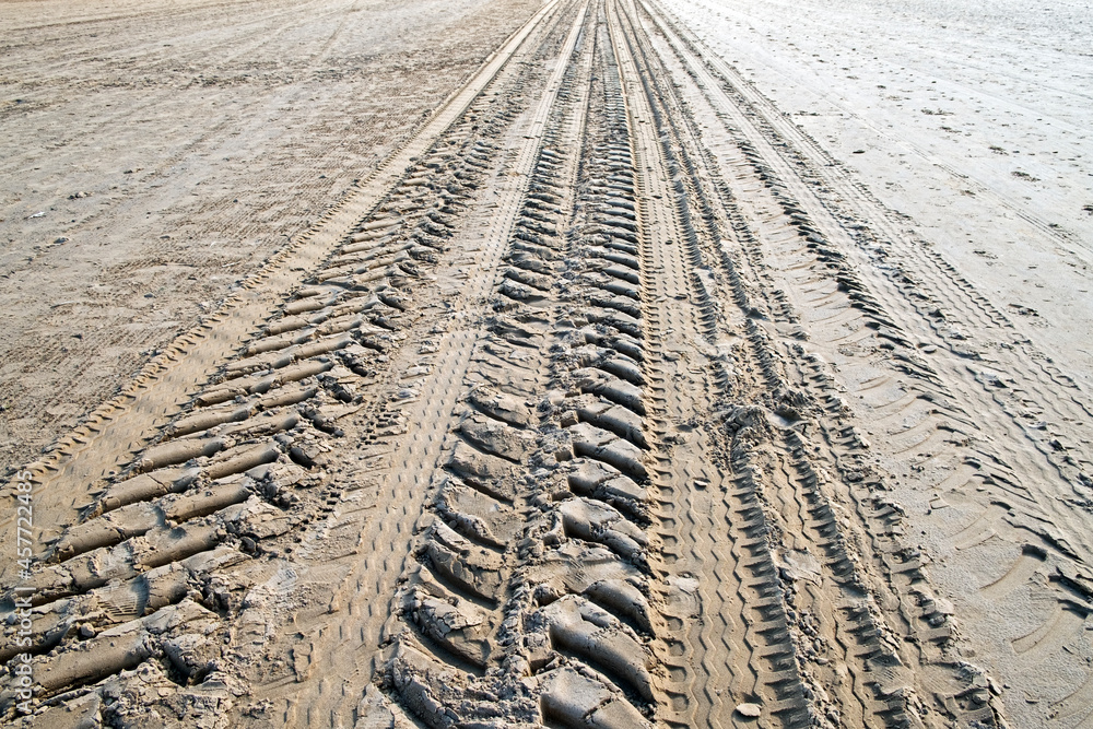 Tyre tracks in the sand on the beach in WestonsuperMare, UK Photos