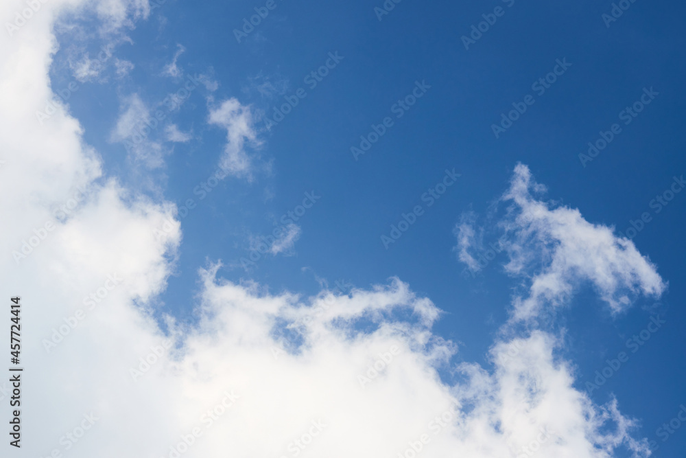 Cloud in the sky closeup over clear blue sky diagonal composition with copyspace. Cloud in the sky closeup over clear blue sky diagonal composition with copyspace.
