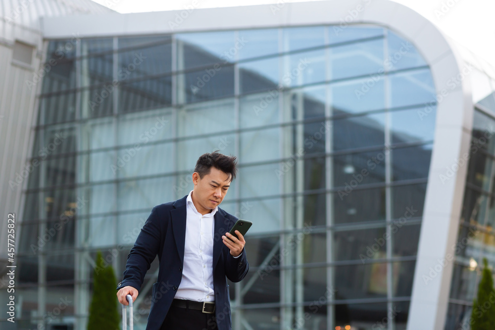 Businessman corresponded in a mobile phone uses the messenger application to communicate with colleagues at a distance Businessman corresponded in a mobile phone uses the messenger application to communicate with colleagues at a distance