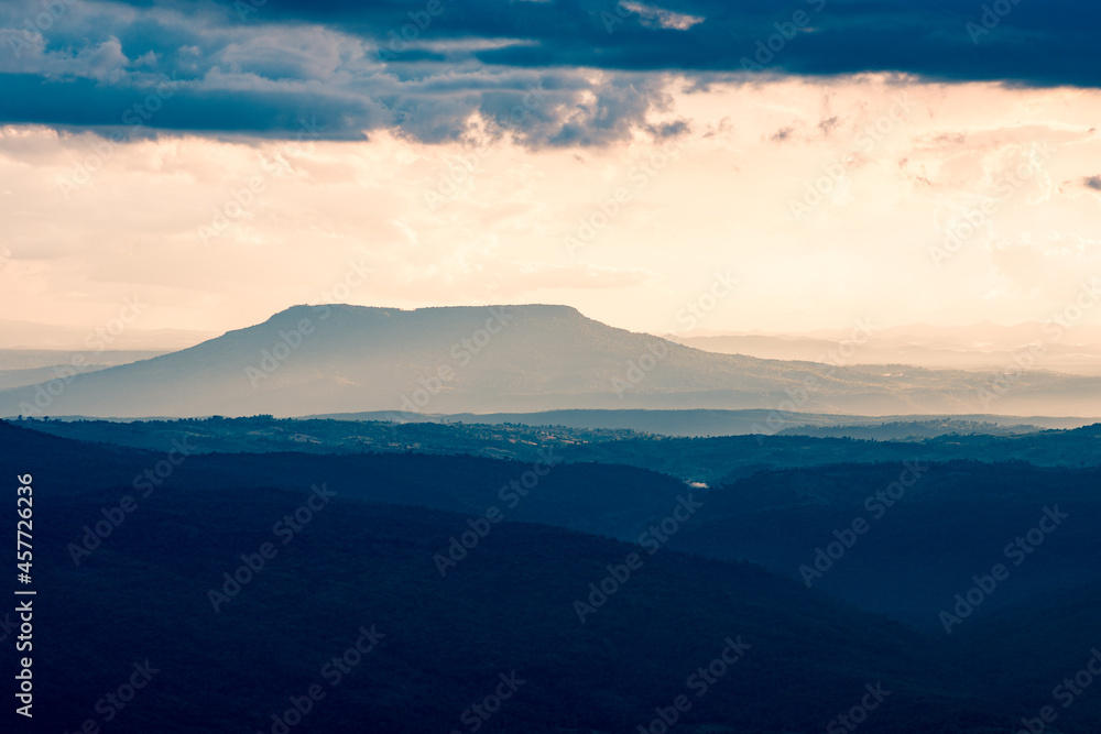 The big mountain and mountain ridges with cloud in a vintage tone, at Phu Kra Dueng National park of Thailand