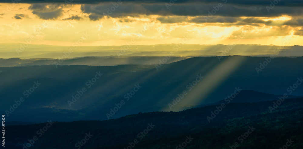 Panoramic landscape of green mountain ridges with sunset sky and cloud at Phu Kra Dueng National park of Thailand