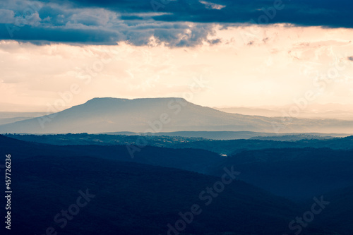 The big mountain and mountain ridges with cloud in a vintage tone, at Phu Kra Dueng National park of Thailand
