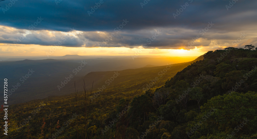 Panoramic landscape of green mountain ridges with sunset sky and cloud at Phu Kra Dueng National park of Thailand