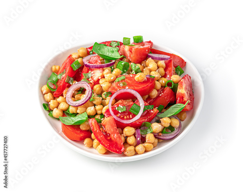 Vegetable salad with chickpeas, tomatoes and sesame seeds isolated on a white background. Healthy food. Close-up..