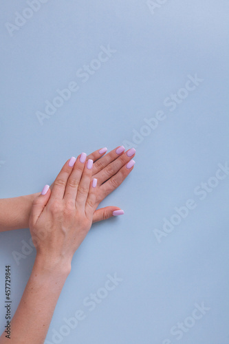 Perfect manicure gel art polish fashion design clean hand woman closeup on isolated background