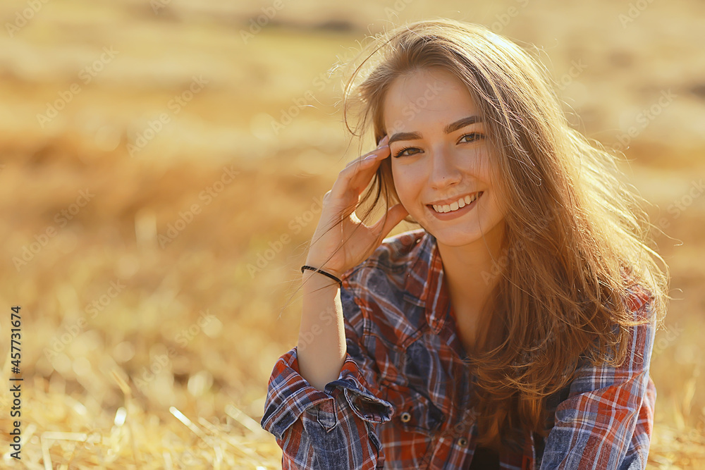 cheerful happy girl smiling in the summer in the field portrait, young girl happiness lifestyle