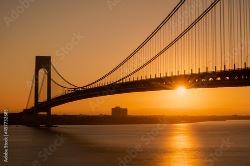 Staten Island, NY - USA - Sept. 18th 2021: A landscape view of the Verrazzano-Narrows Bridge,seen from Fort Wadsworth in the Gateway National Recreation Area during the golden hour.