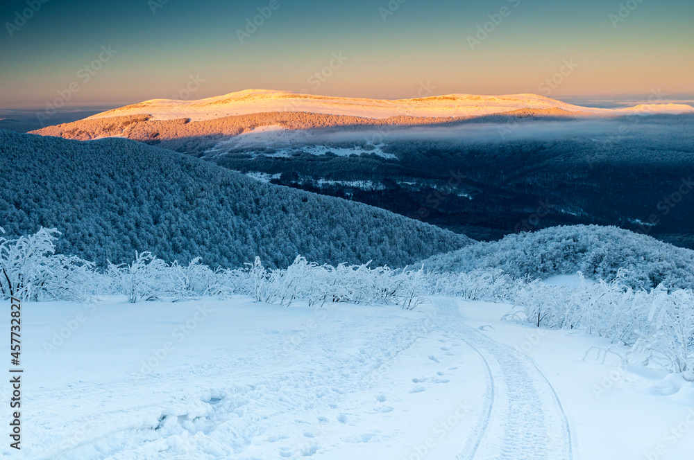 A view from the top of Wielka Rawka to the Bieszczady peaks at sunset, the Bieszczady Mountains A view from the top of Wielka Rawka to the Bieszczady peaks at sunset, the Bieszczady Mountains