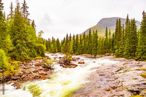 Fototapeta Naklejka Na Ścianę i Meble -  Fast flowing river water of beautiful waterfall Rjukandefossen Hemsedal Norway.