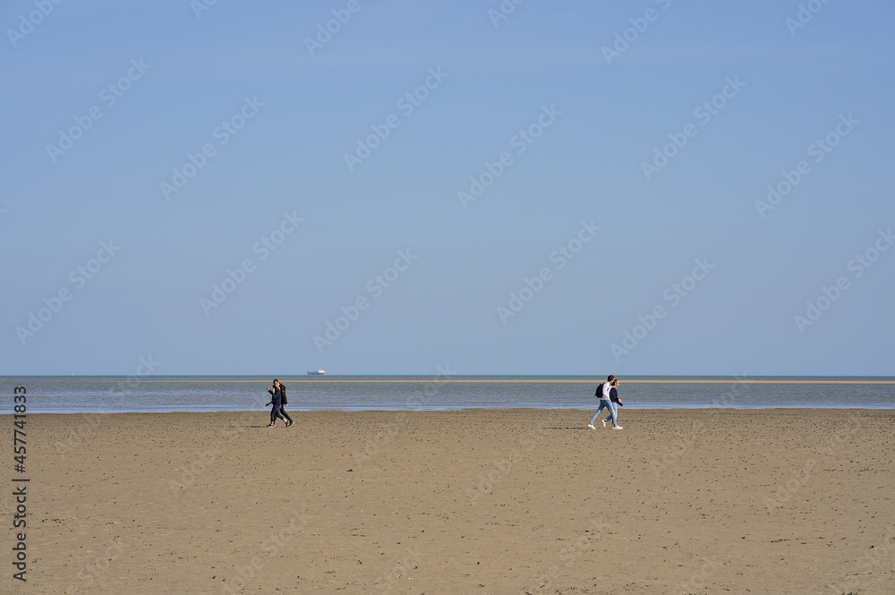 Beautiful bright view of Sandymount Beach, Dublin, Ireland. Walking people. Open spaces. High resolution