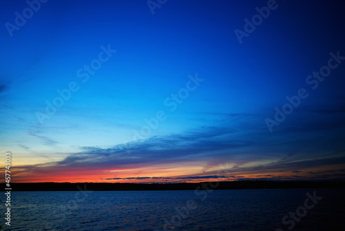 Burning sunset on river landscape background © spacedrone808