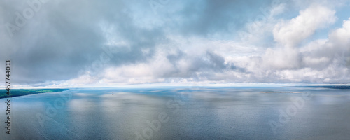 Dramatic clouds over Volga river large panoramic view photo