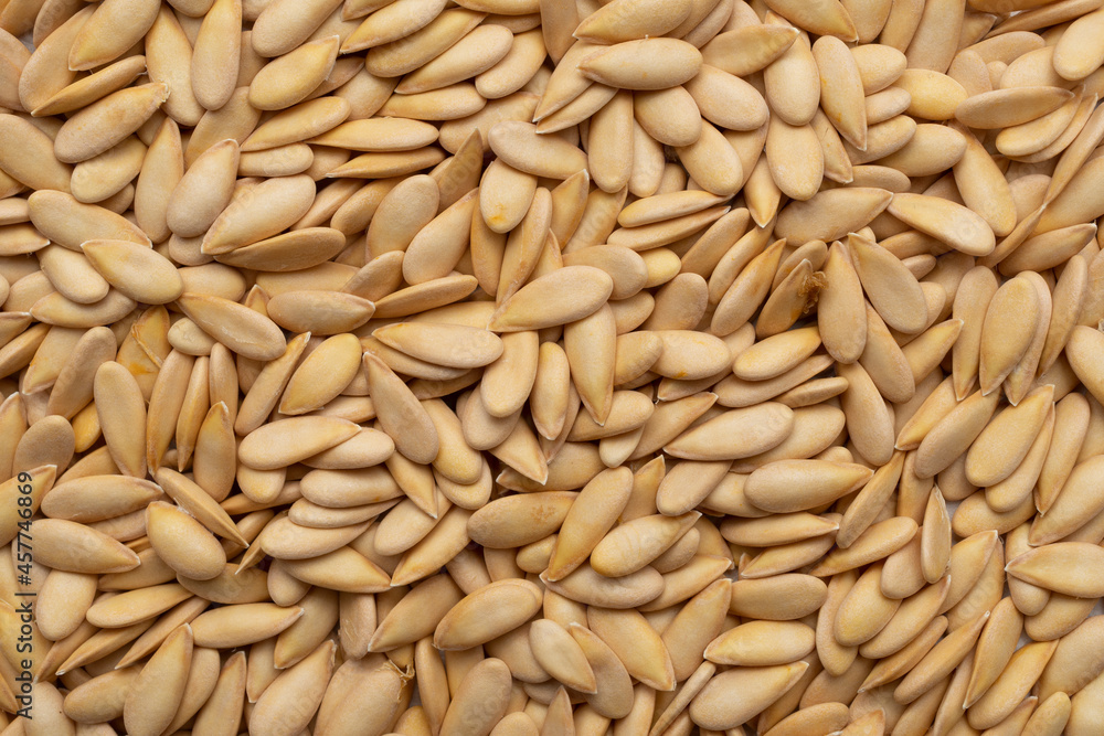 Dry organic melon seeds top view background