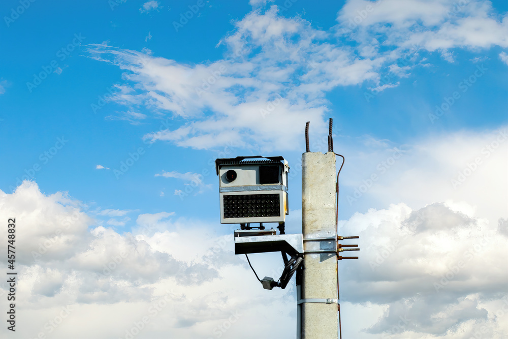 Radar speed camera against blue sky background Radar speed camera against blue sky background