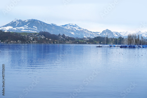 beautiful view of autumn, winter Lucerne historic sites in switzerland, tourist boats on the picturesque shore of lake of Lucerne, panorama of mountains, nature and ecology concept