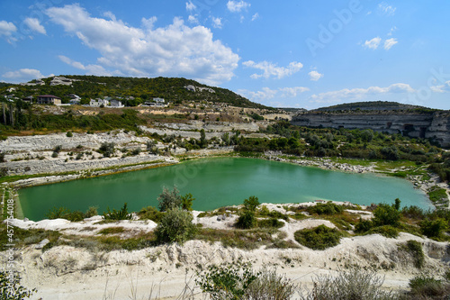 Photo of a stone quarry with an artificial lake