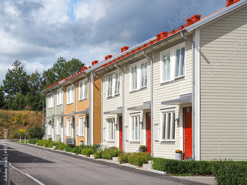 Street with Scandinavian style townhouses or condominium apartments 