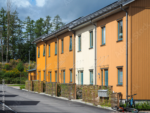 Street with Scandinavian style townhouses or condominium apartments 
