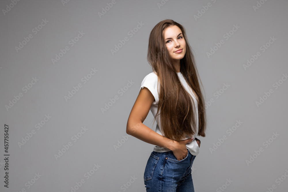 Portrait happy woman on the gray background. Portrait happy woman on the gray background.