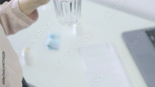 Wallpaper Mural The girl takes the ascorbic acid and washes it down with water. Vitamin C to increase immunity. Ascorbic acid in dragees Torontodigital.ca