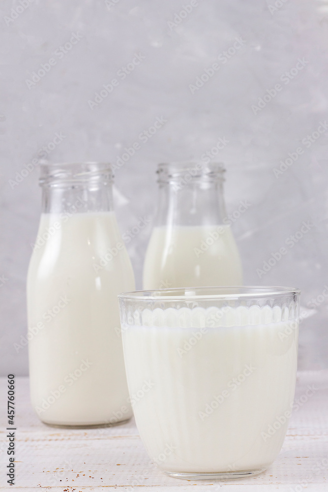 Tasty fresh milk on a white wooden background. a glass of milk. Milk. copy space Tasty fresh milk on a white wooden background. a glass of milk. Milk. copy space