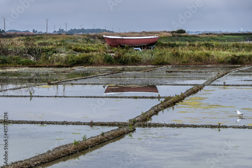 Guerande salt marshes. Salterns of Guerande - swamp of salt water about 1 700 hectares in size. Guerande - medieval town in department of Loire-Atlantique in Pays de la Loire in western France. photo