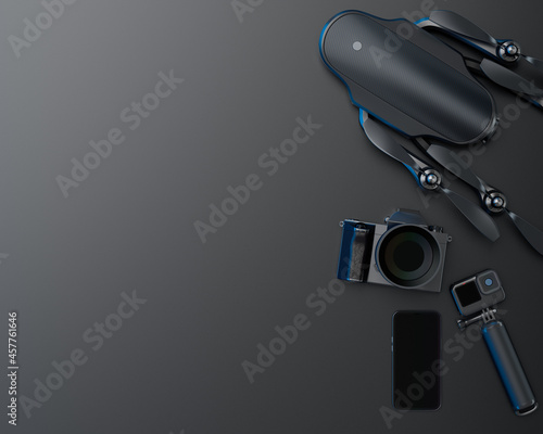 Top view of designer workspace and photography gear on black table background