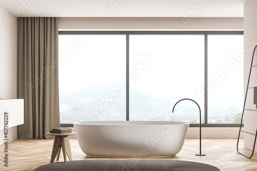 Oval bathtub in modern panoramic beige bathroom