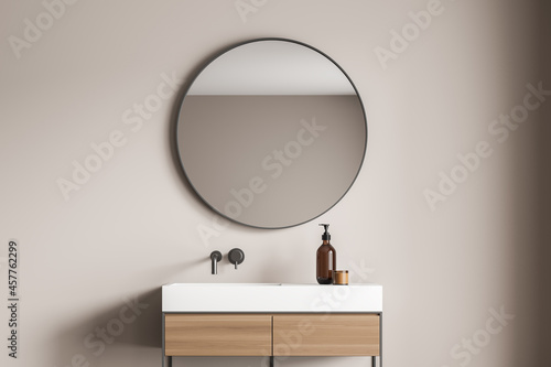 Fotografie Beige bathroom wall with a stylish vanity