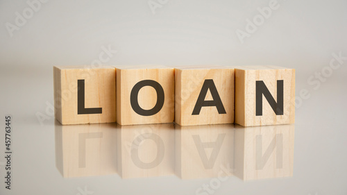 Εκτύπωση καμβά Four wooden cubes with letters LOAN. Business marketing concept