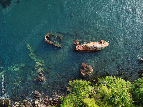 Wrecked ship on Caribbean sea aerial drone view