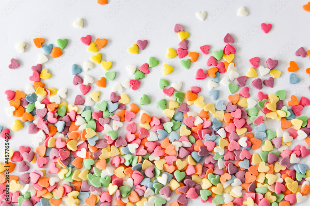 Dynamic splash of multicolored heart candies creating an energetic visual, perfect for themes of affection and joy. Dynamic splash of multicolored heart candies creating an energetic visual, perfect for themes of affection and joy.