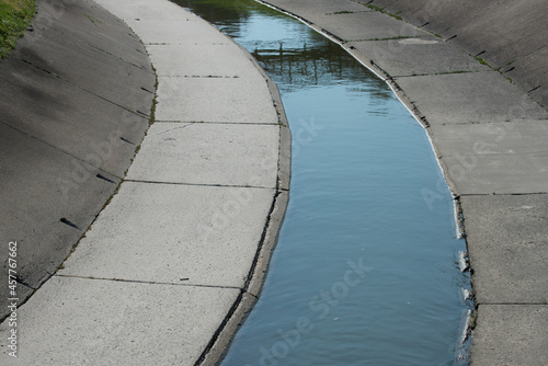 man-made concrete channel of an urban creek