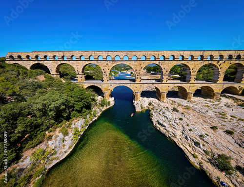 The aerial view of the Pont du Gard, an ancient tri-level Roman aqueduct bridge in France photo
