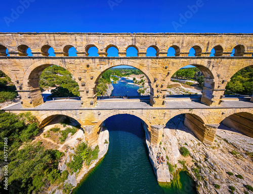 The aerial view of the Pont du Gard, an ancient tri-level Roman aqueduct bridge in France photo