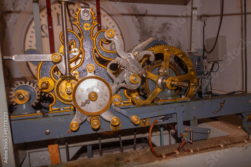 handcrafted antique bell tower clock mechanism from the 19th century that moves 4 clocks, one for each face