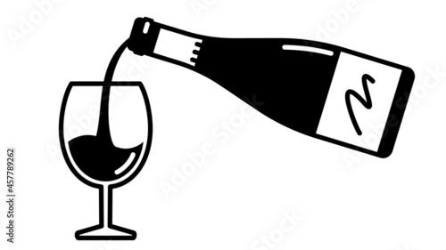 Wine bottle and glass. Pouring wine into a glass.