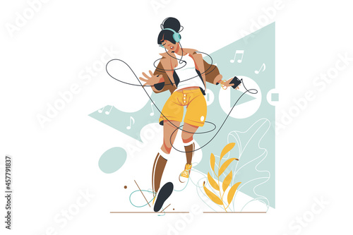 Attractive woman listening and dancing to music.