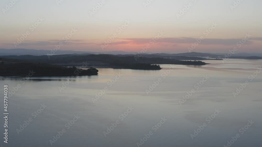 Sunrise over the sea. Calm sea in calm, shining reflections Sunrise over the sea. Calm sea in calm, shining reflections